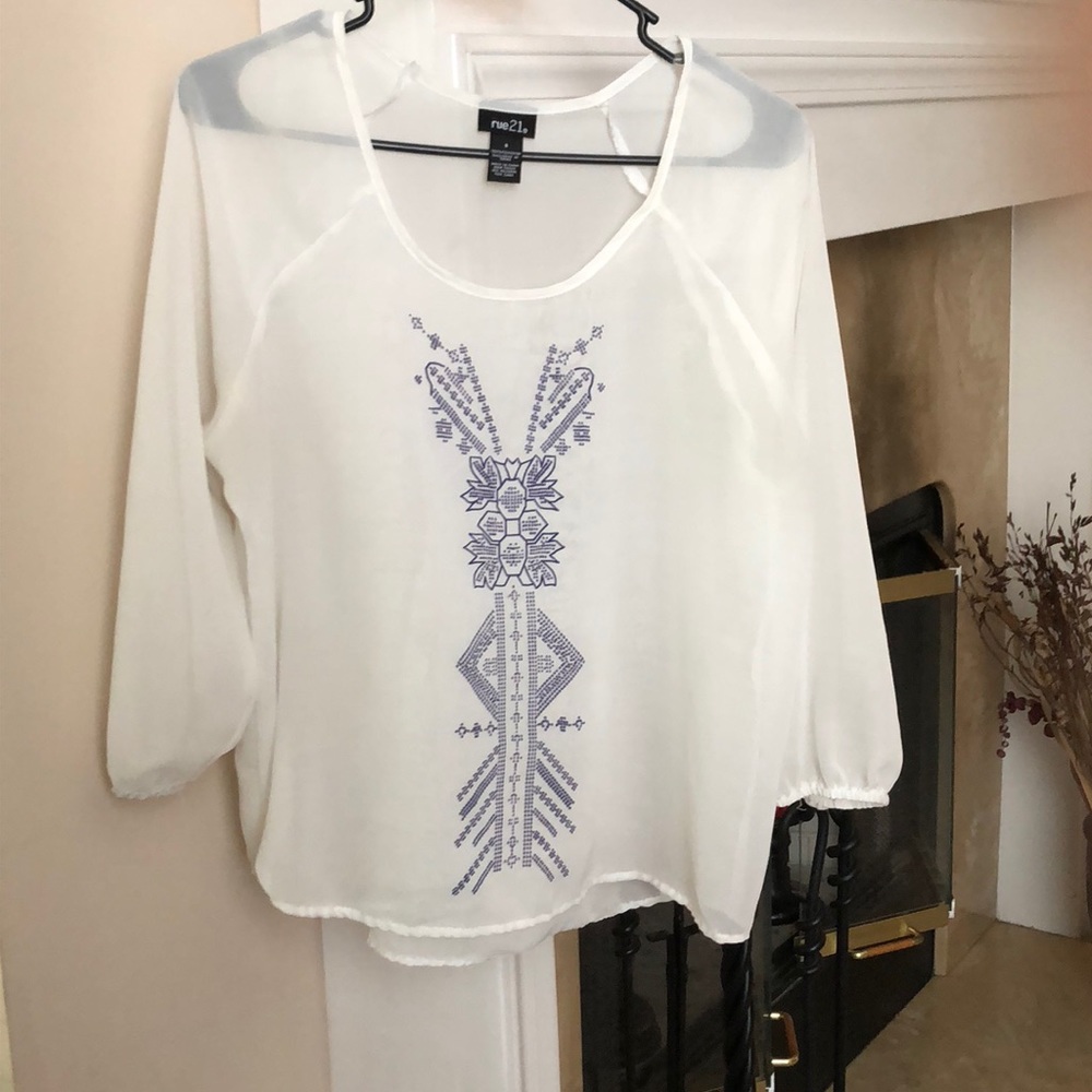 Off white sheer shirt w/blue Aztec design front.
